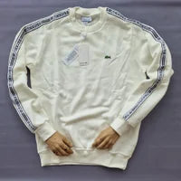 Sudadera LACOSTE crema laterales gris y blanco logo verde