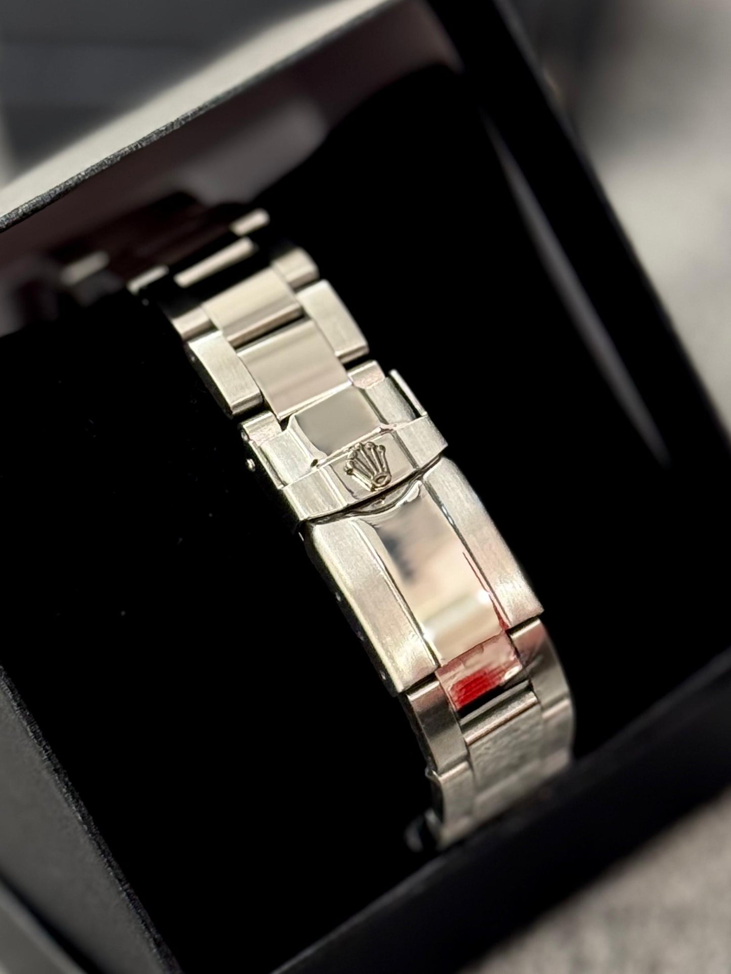 Reloj Rolex plateado y negro