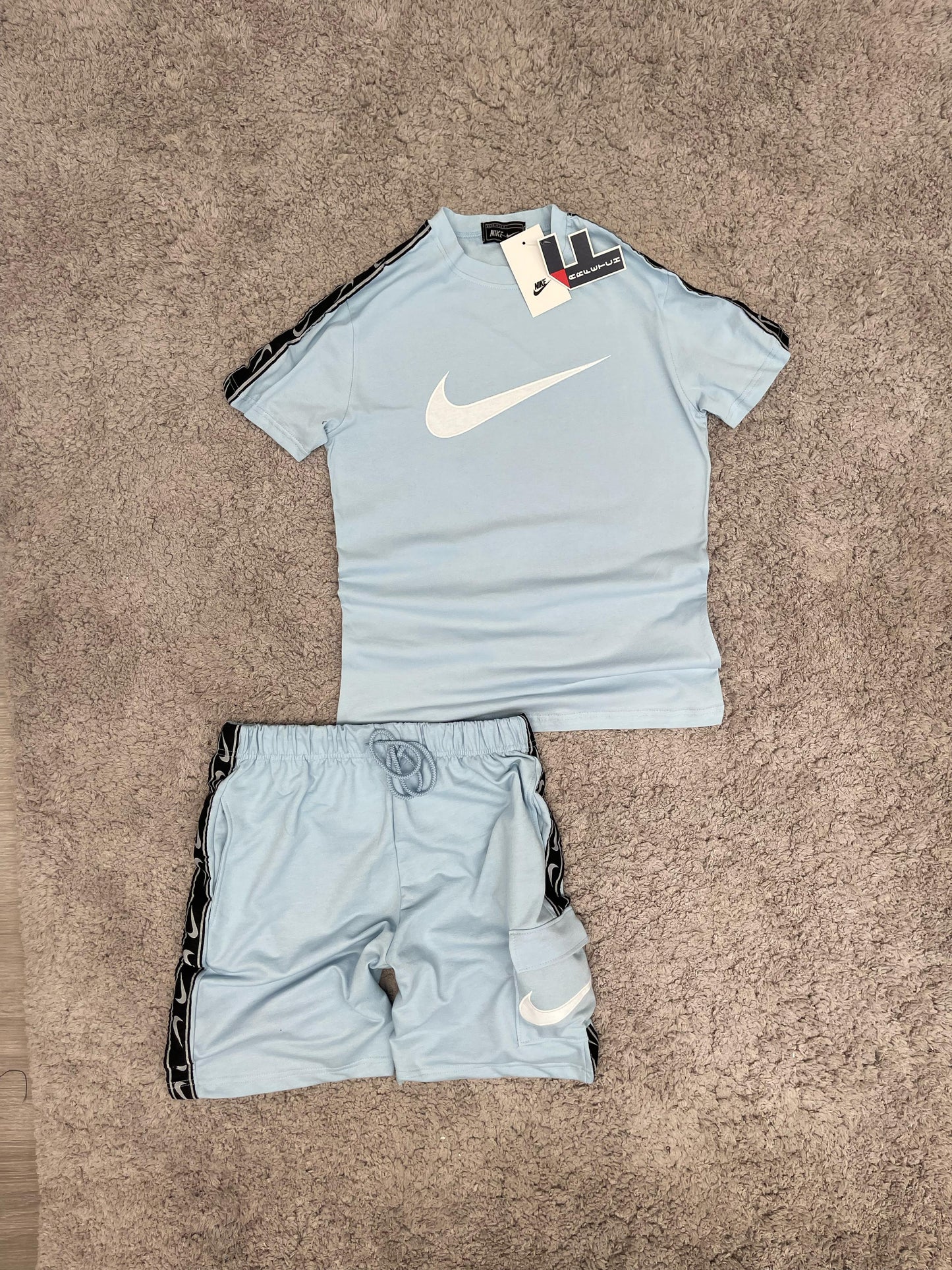 CONJUNTO Nike azul claro logo blanco
