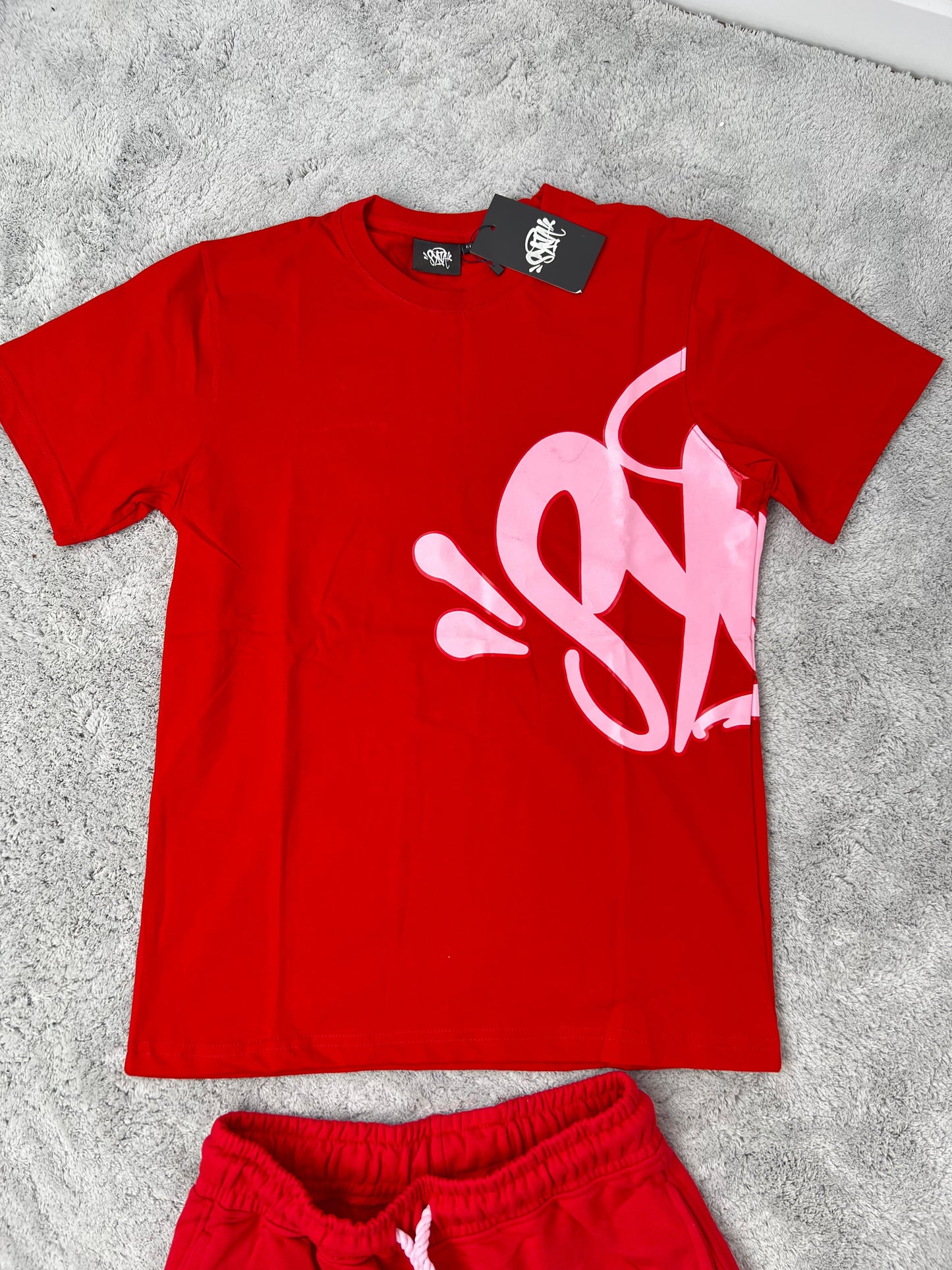 Conjunto corto syna rojo logo rosa