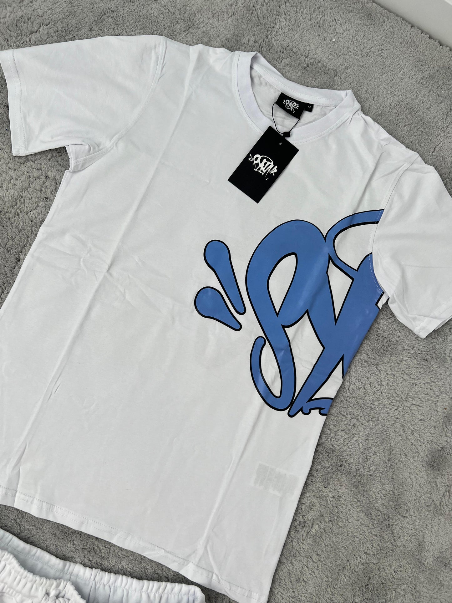 Conjunto corto syna blanco logo azul