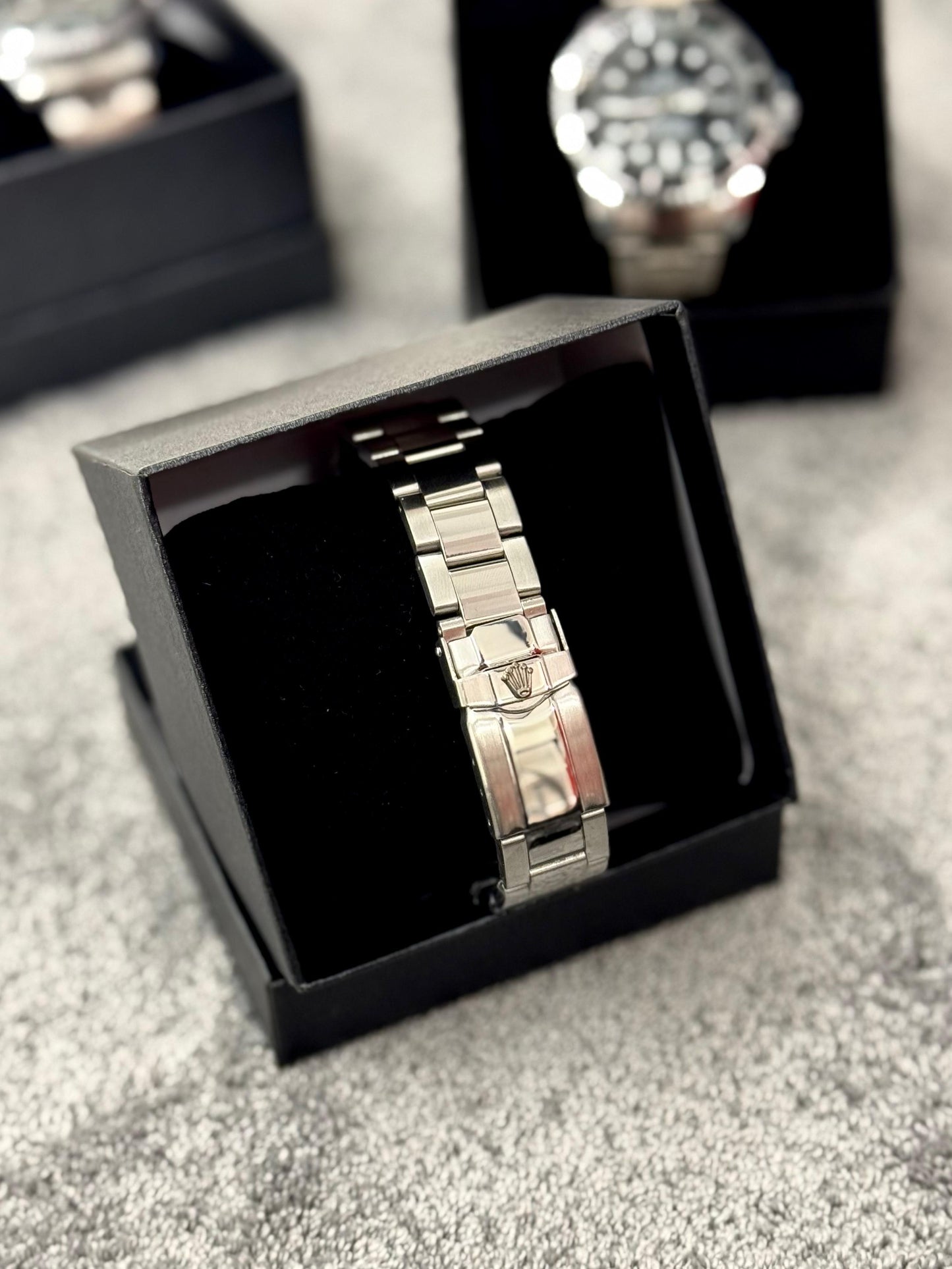 Reloj Rolex plateado y negro