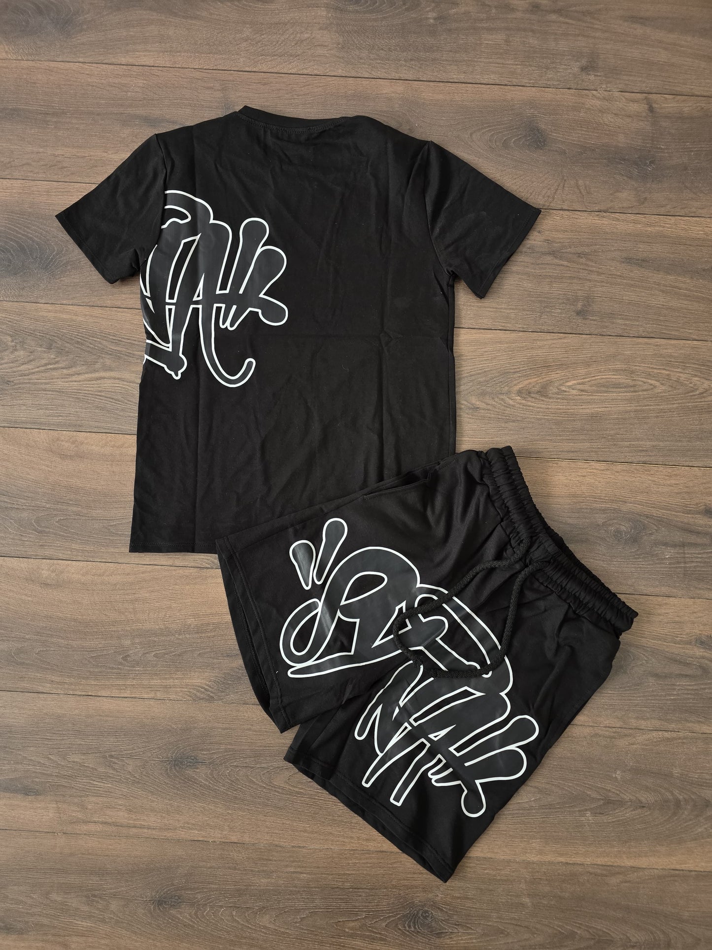 Conjunto verano syna negro bordes blancos