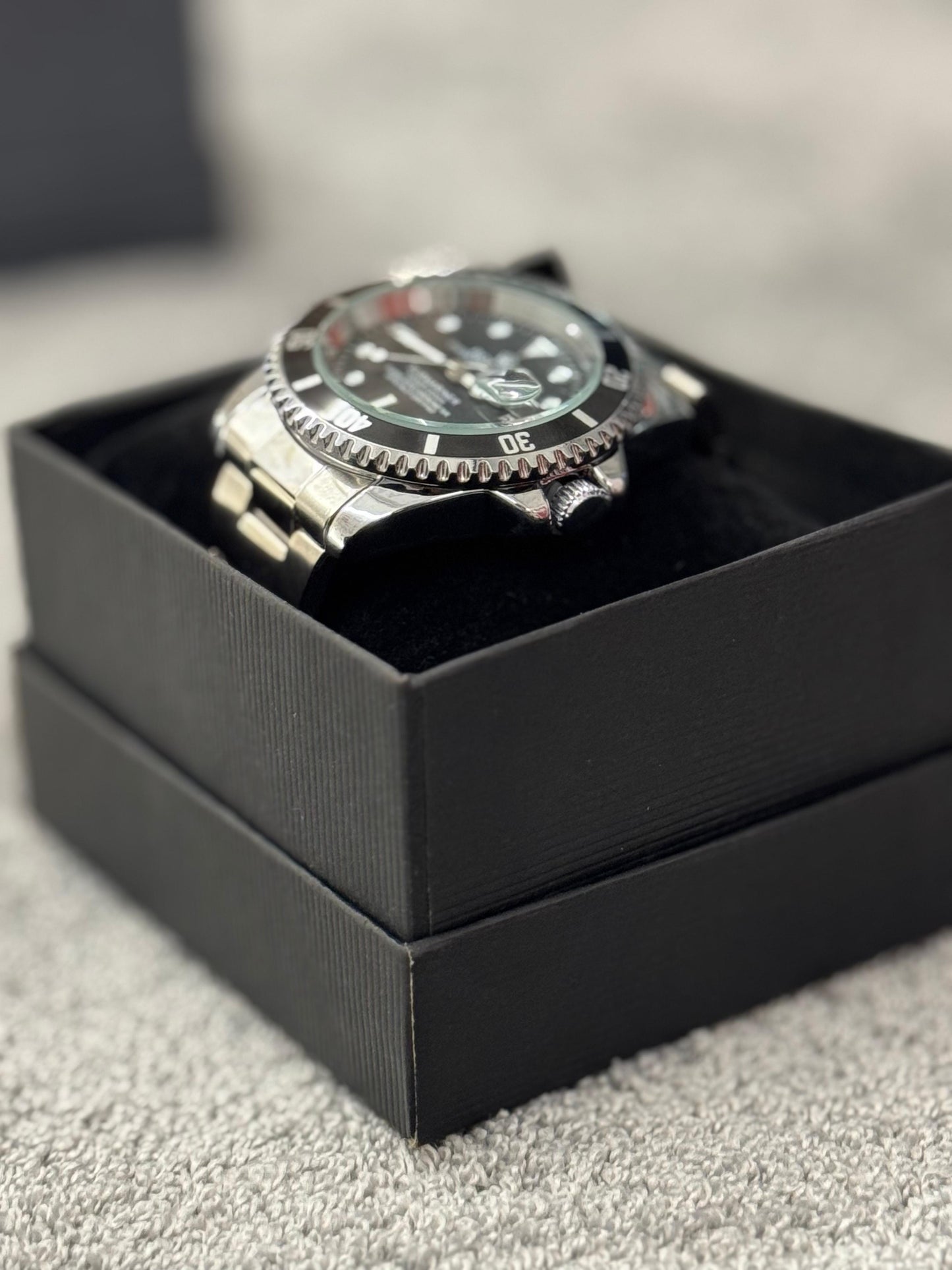 Reloj Rolex plateado y negro