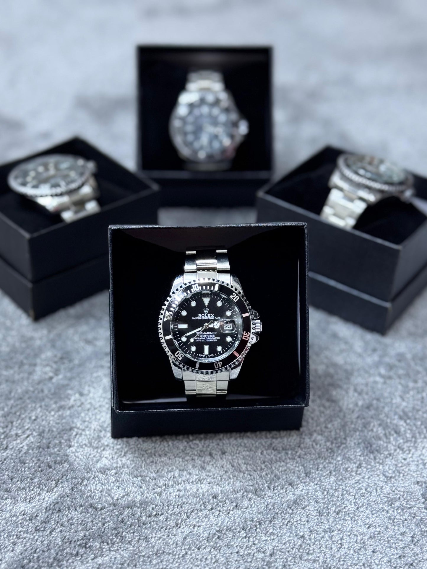 Reloj Rolex plateado y negro