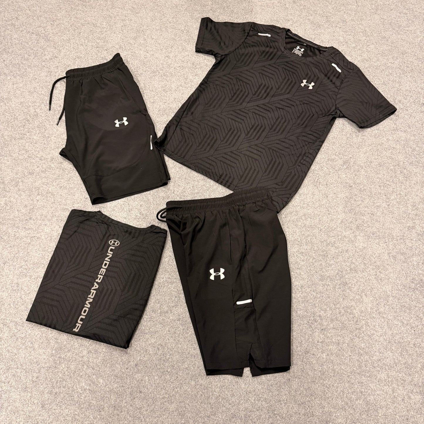 Conjunto under armour negro logo blanco