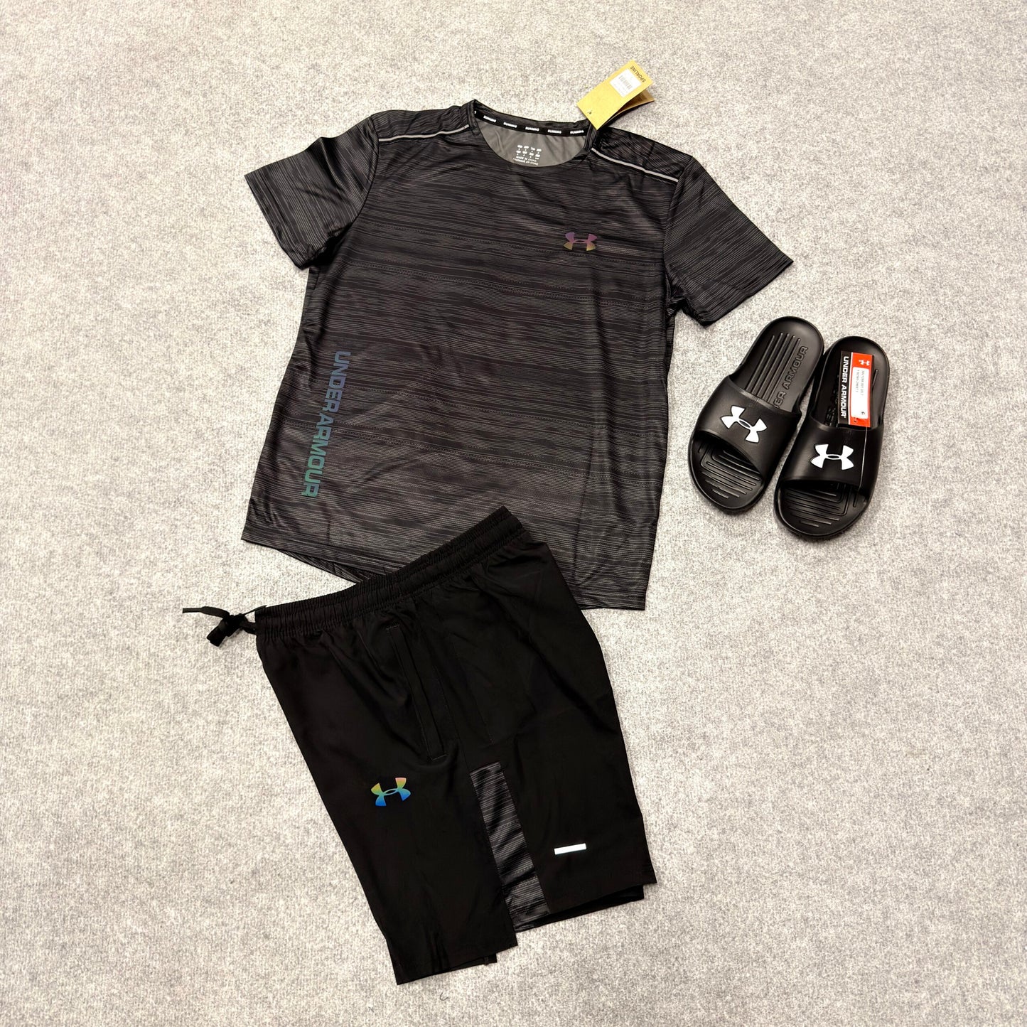 Conjunto under armour negro y gris logo reflectante