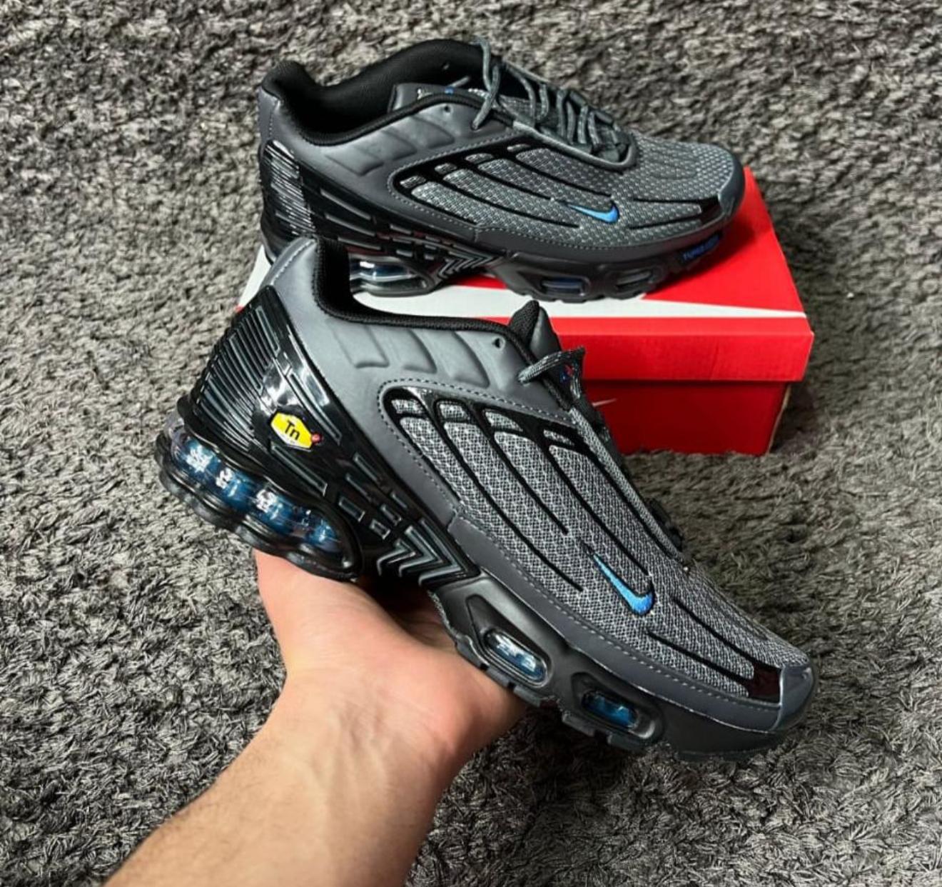 TN Tunned grises logo azul detalles negros