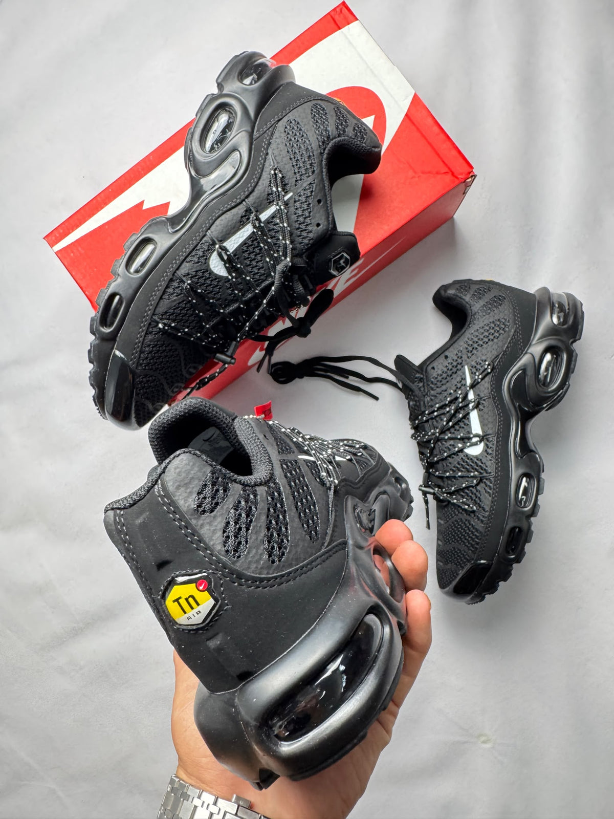Nike Tl negras logo blanco