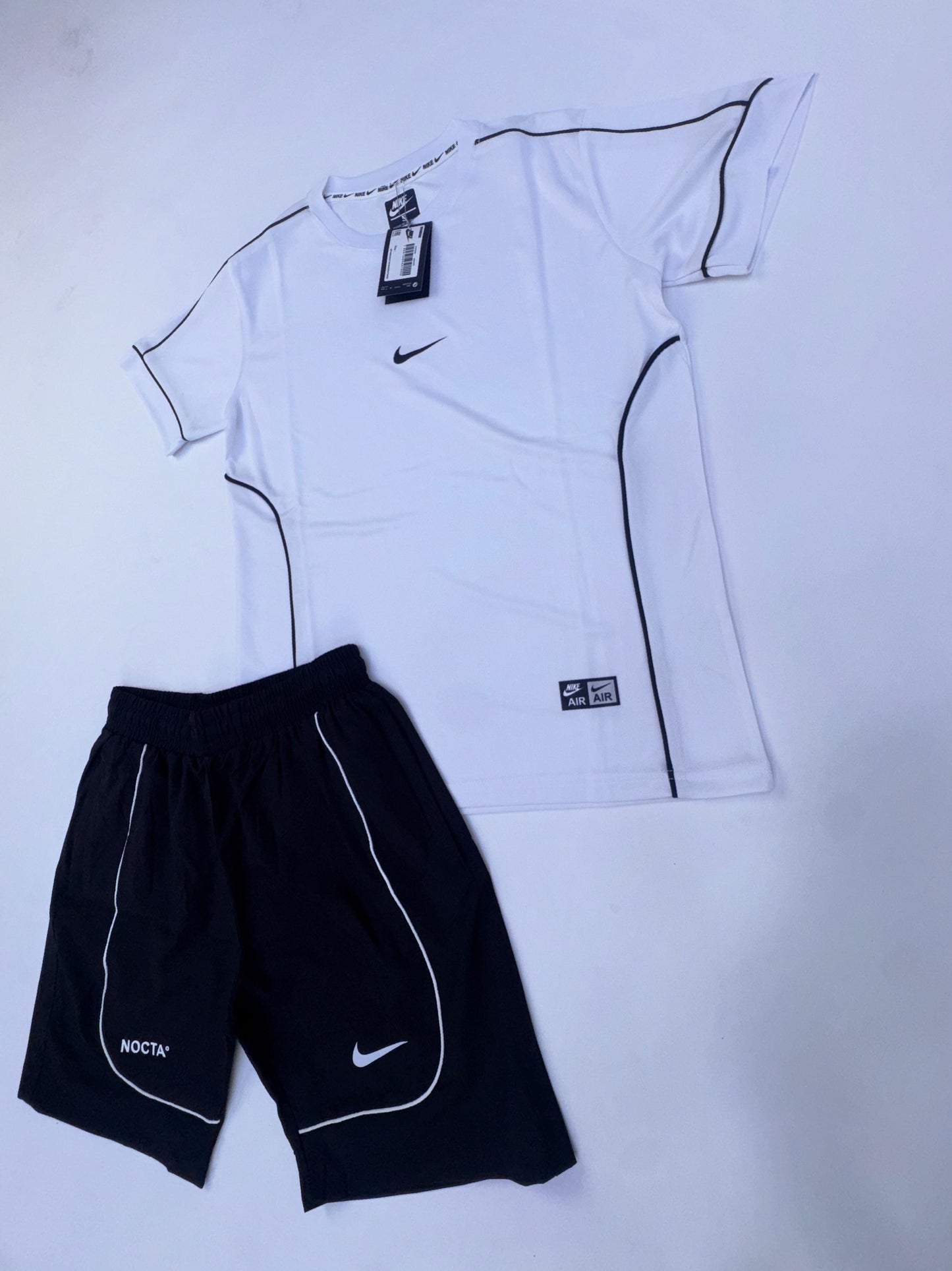 Conjunto corto nike x nocta blanco logo negro lineas negras