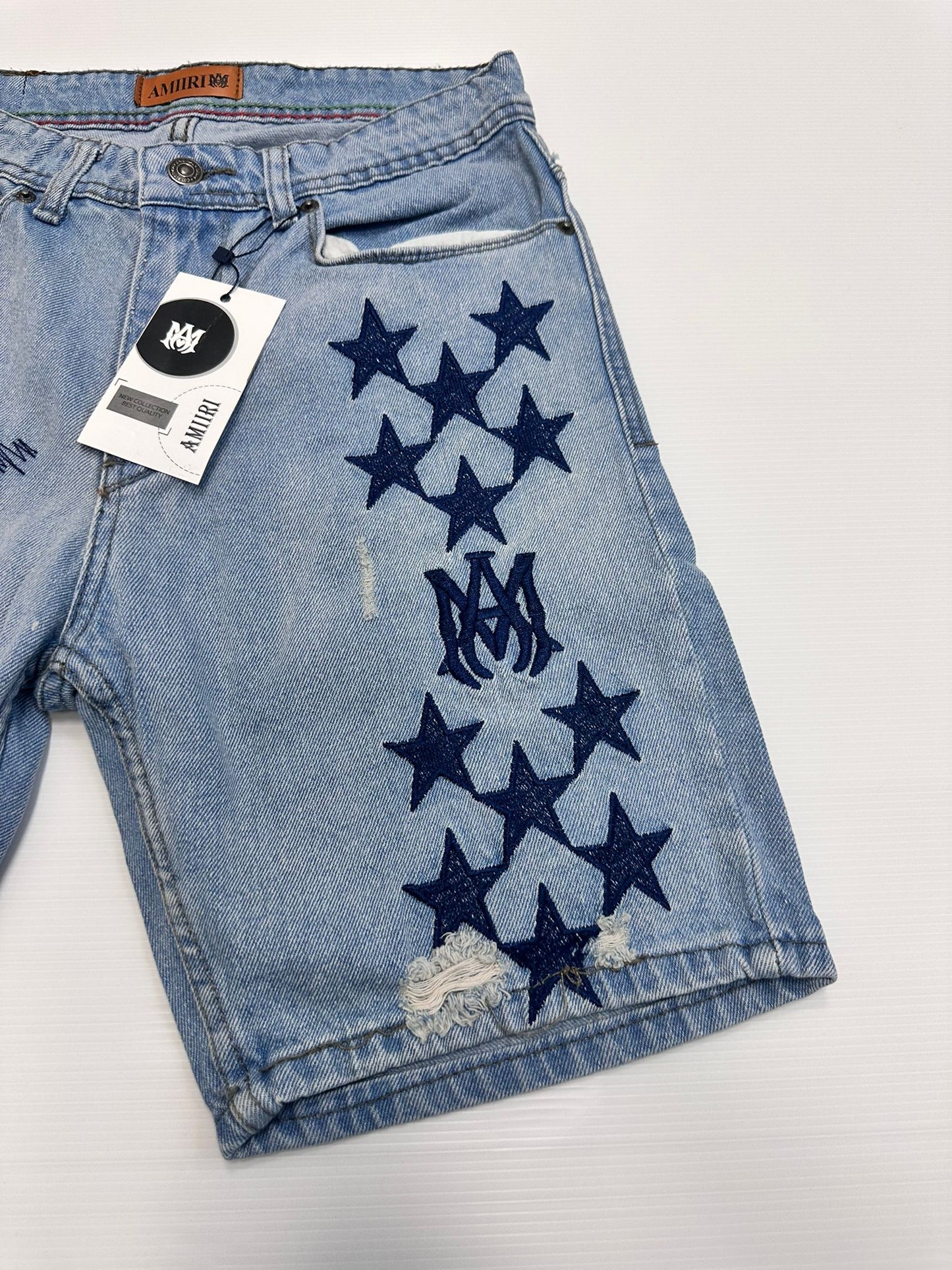 Pantalon corto amiri logos azules marinos