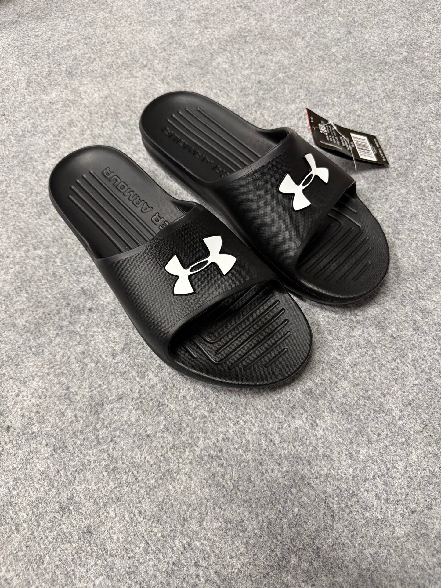 Chanclas under armour negro logo blanco