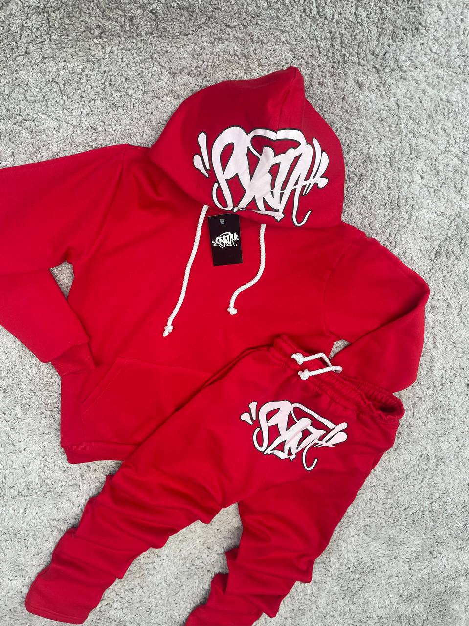 CHANDAL SYNA rojo logo blanco