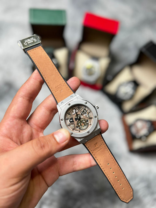 RELOJ HUBLOT gris y marron claro