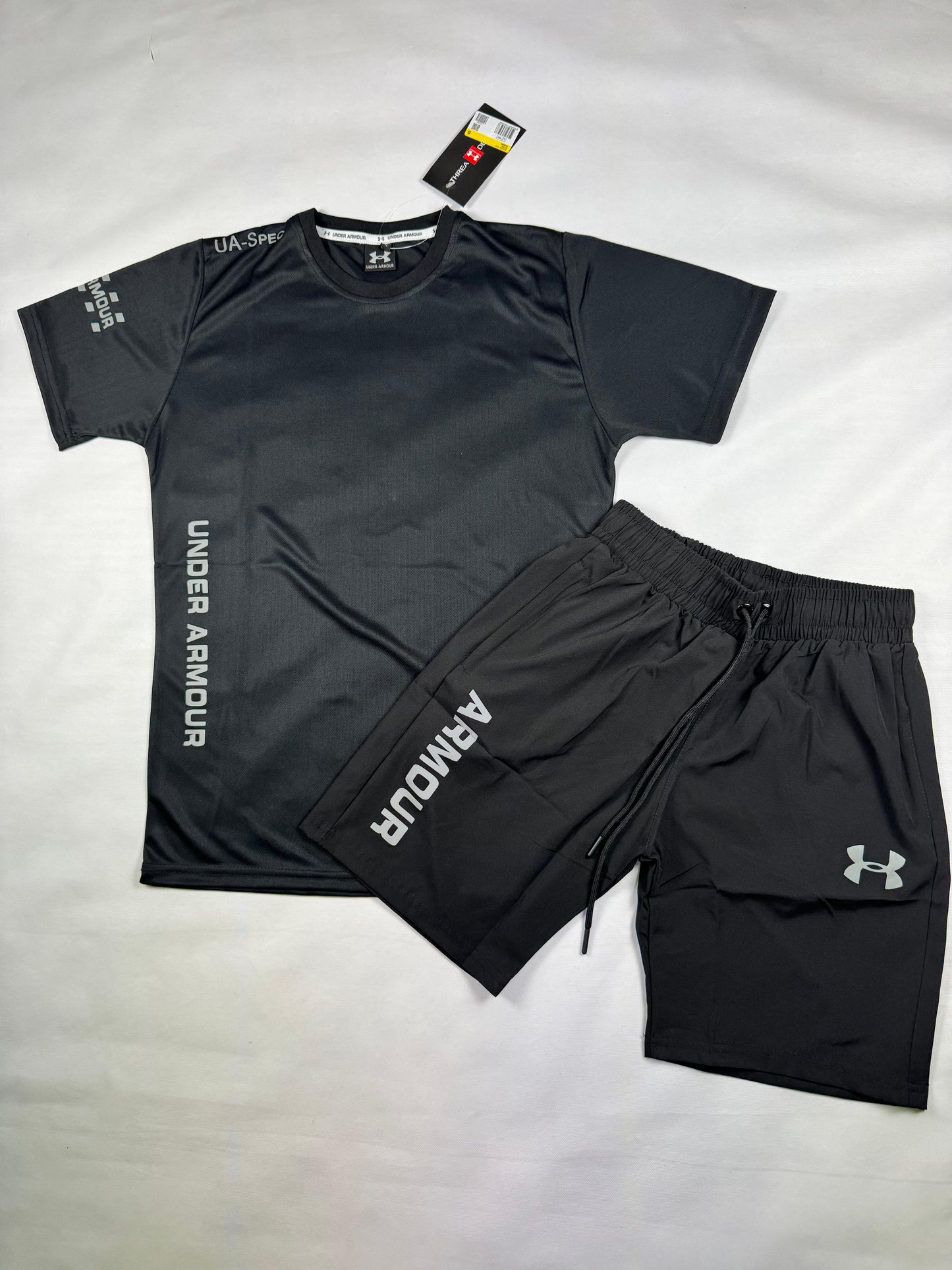Conjunto under armour negro logo blanco