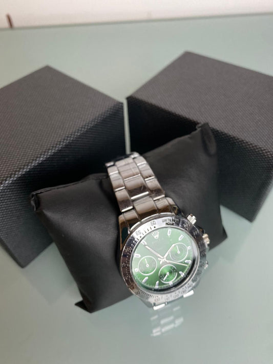 Reloj Rolex plateado y verde