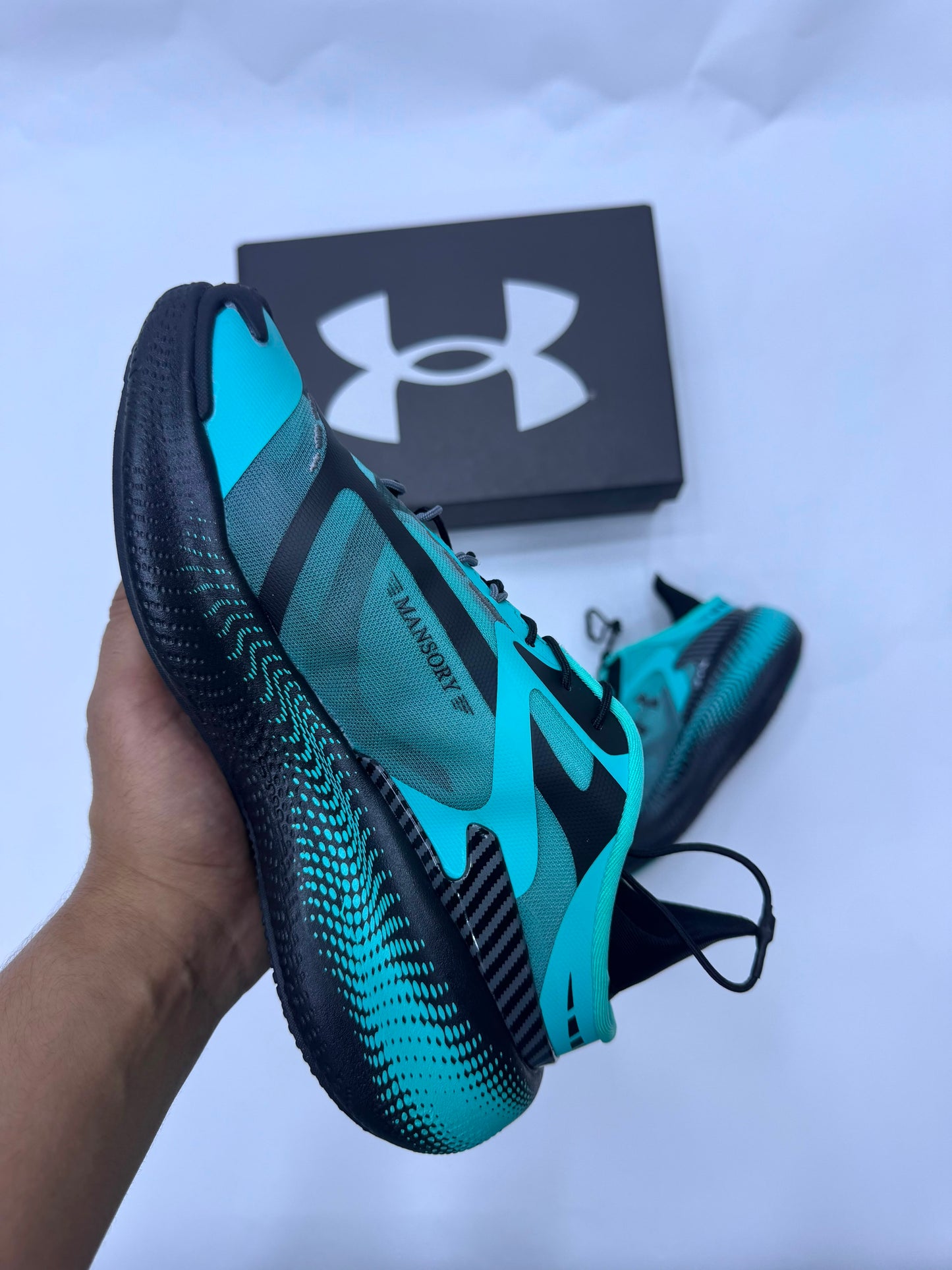 Mansory × Under Armour azules logo negro