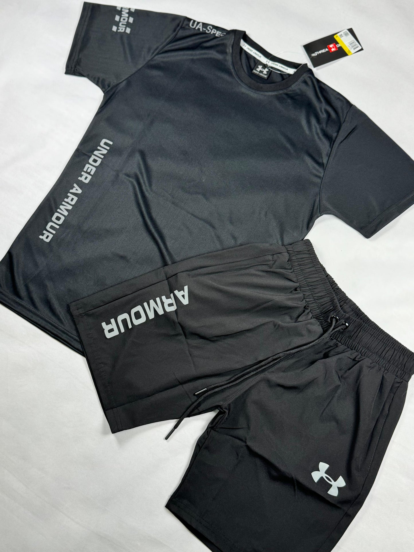 Conjunto under armour negro logo blanco