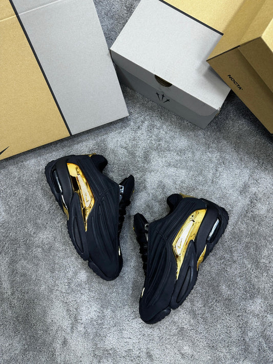 Nocta negra logo dorado