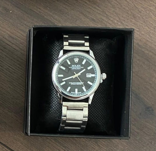Reloj Rolex plateado negro