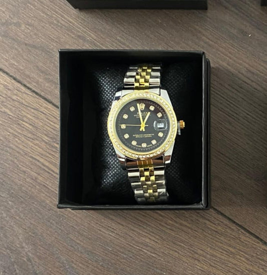 Reloj Rolex dorado negro y plateado