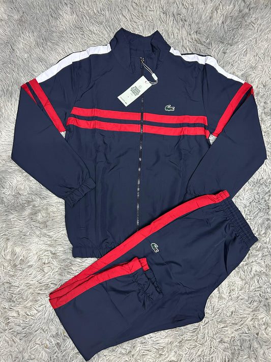 Chandal lacoste azul logo verde detalles rojos y blancas