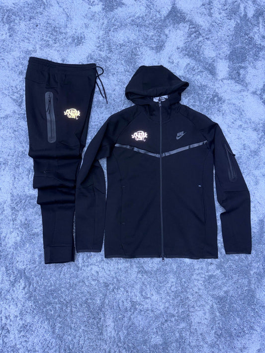 Chandal Nike Tech X synaworld negro logo naranja
