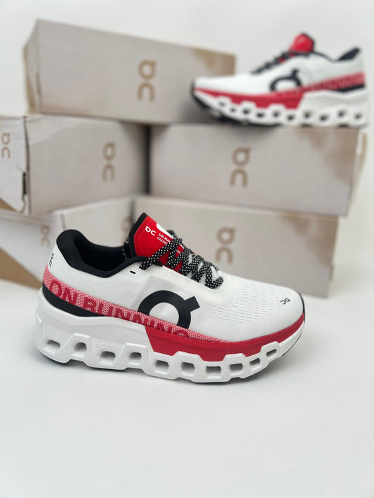 Zapatillas On Running Cloudmonster 2 blancas detalles rojos logo negro
