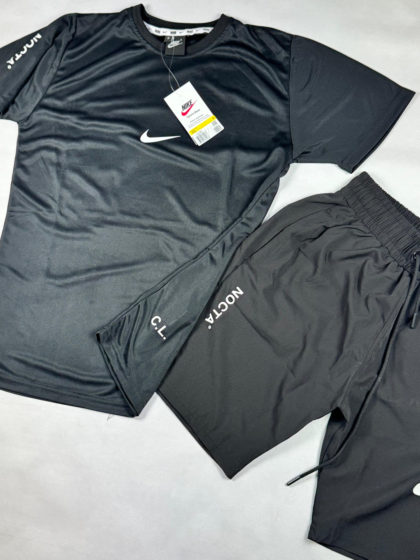 Conjunto nike x nocta negro logo blanco