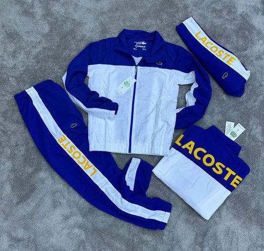Chandal LACOSTE azul y blanco logo amarillo en espalda