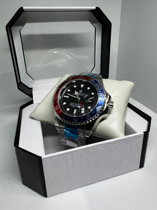 RELOJ ROLEX gris negro rojo y azul