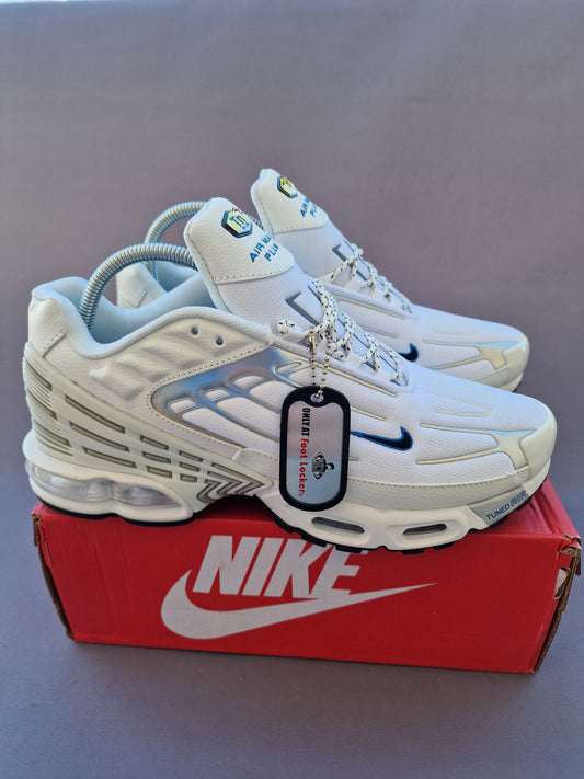 Nike tn tunned blancas y grises logo negro contorno azul