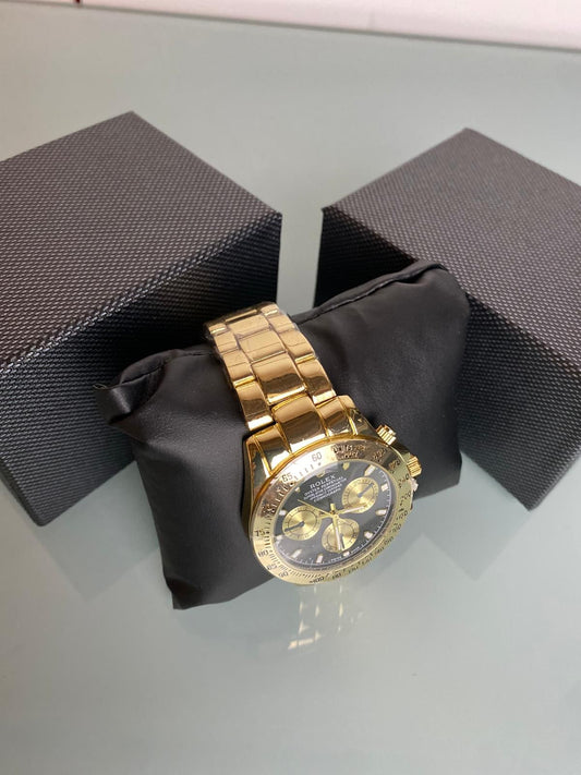 Reloj Rolex dorado y negro