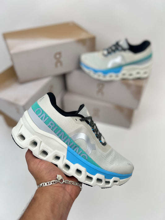Zapatillas On Running Cloudmonster 2 grises detalles azules