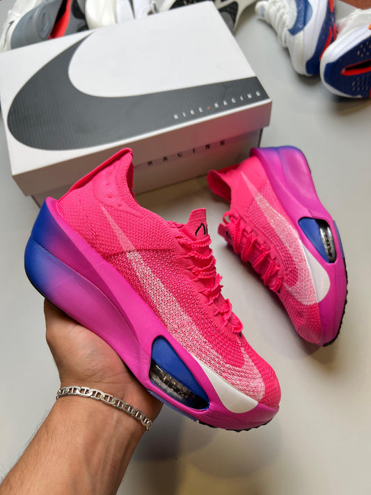 NIKE AIR ZOOM ALPHAFLY NEXT % rosas logo blanco detalles azules y rosas