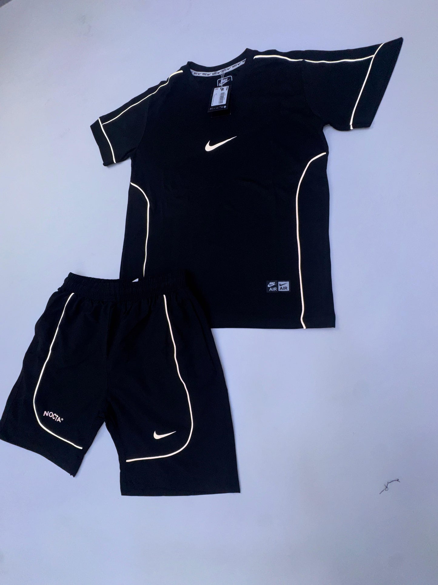 Conjunto corto nike x nocta negra logo blanco lineas blancas