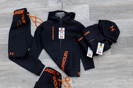 Chandal under armour negro logo naranja