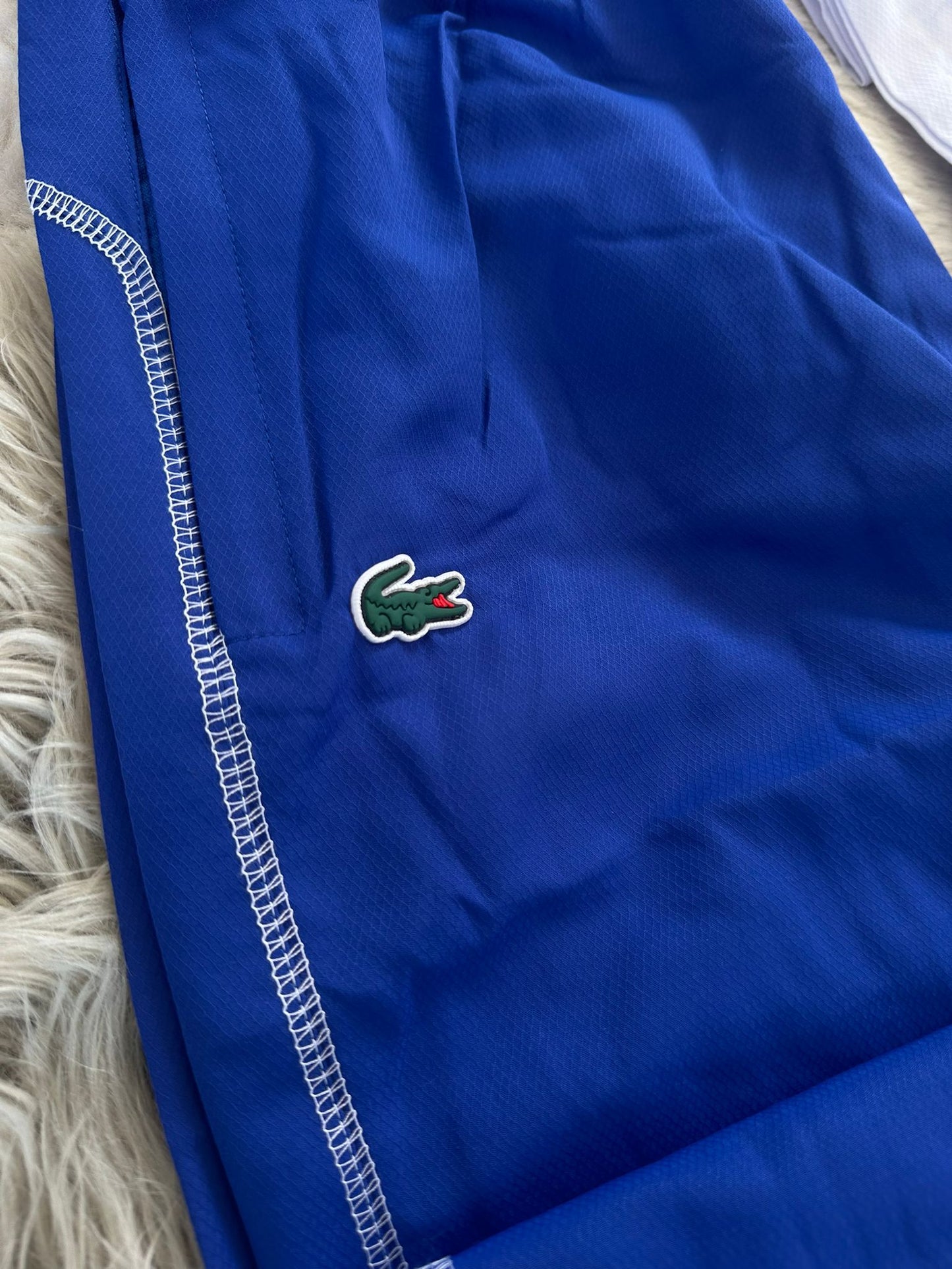 Chandal Lacoste azul y blanco logo verde