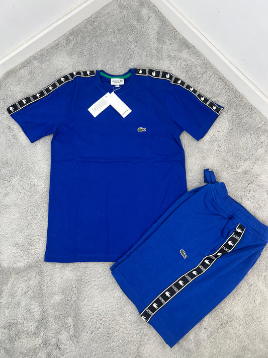 Conjunto corto lacoste azul logo verde lineas negras