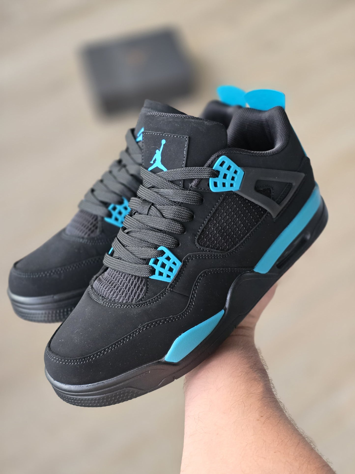 JORDAN 4 NEGRA AZUL