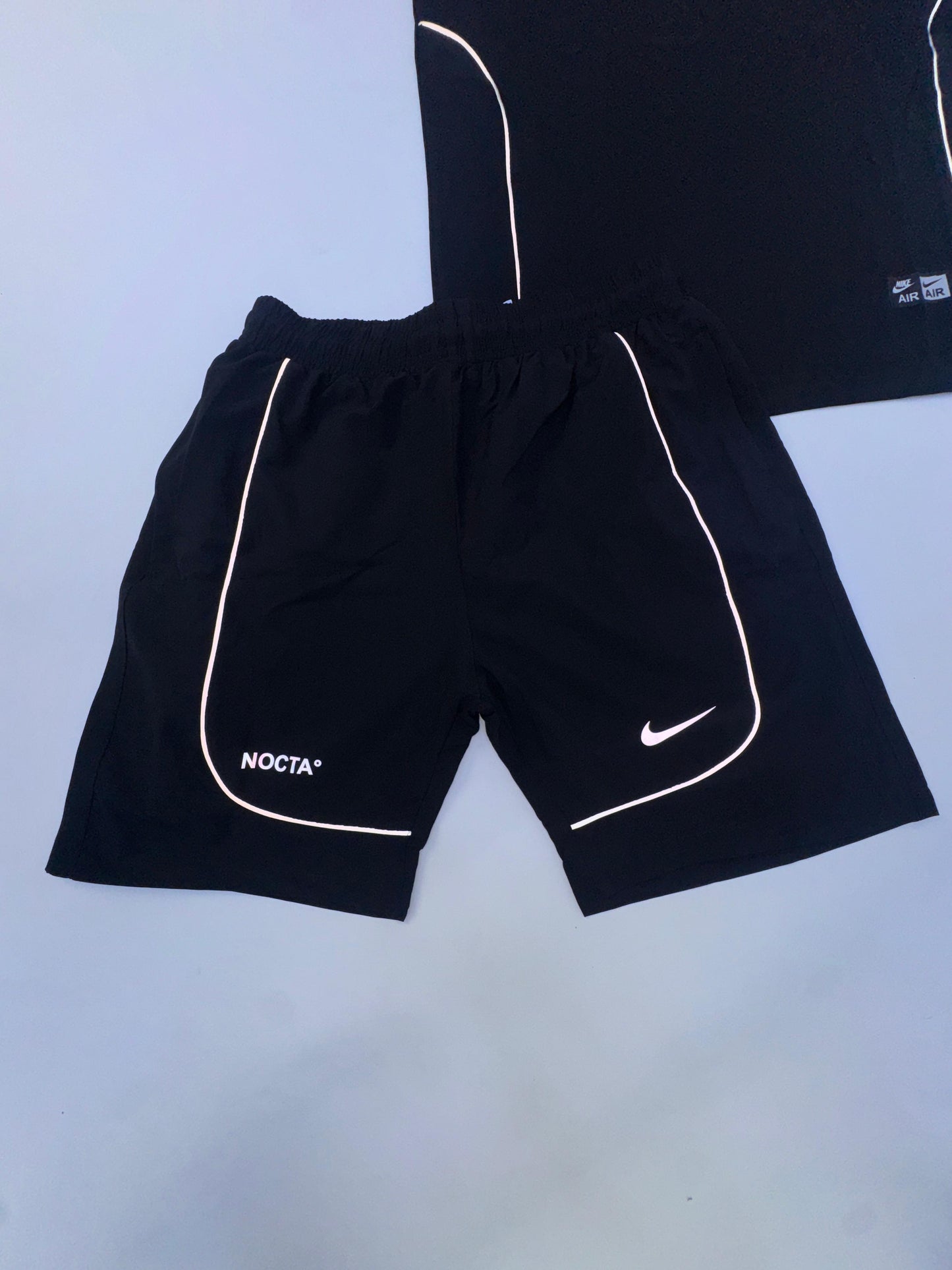 Conjunto corto nike x nocta negra logo blanco lineas blancas