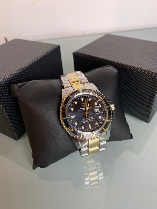 Reloj Rolex dorado y negro