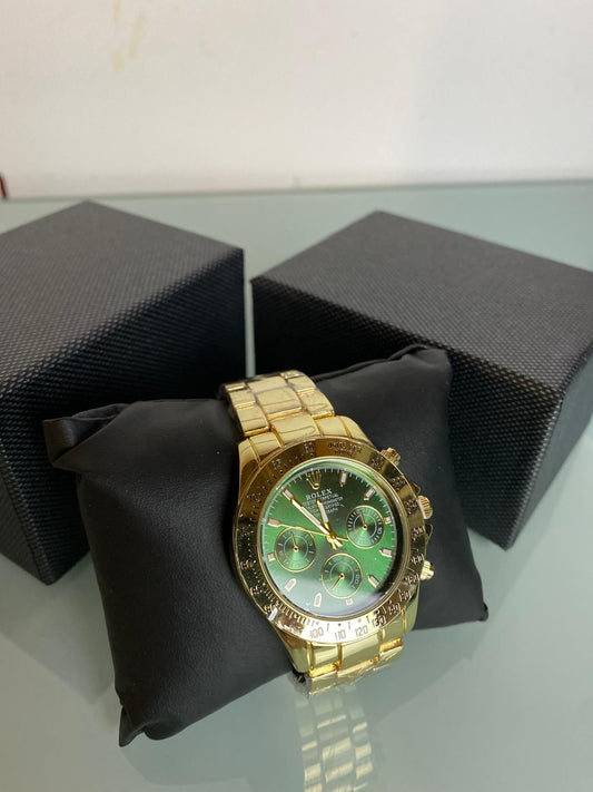 Reloj Rolex dorado y verde