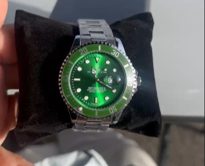 Reloj Rolex plateado verde detalles blancos