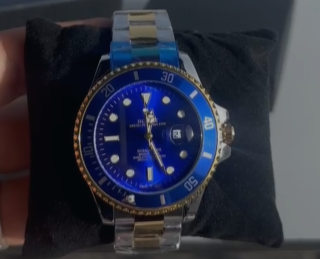 Reloj Rolex plateado y dorado azul