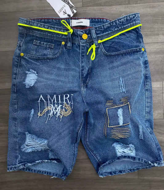 Pantalon corto amiri azul logo blanco detalles dorados y fluor