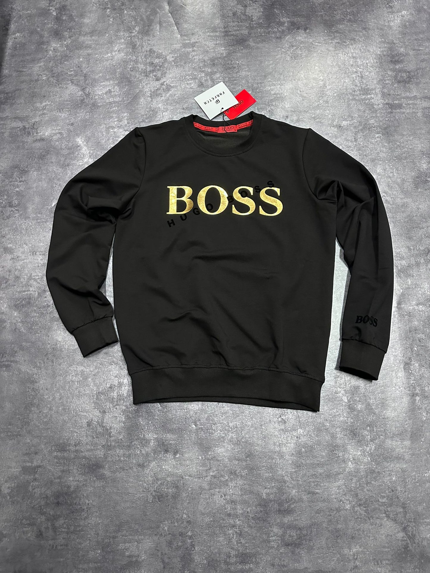 Sudadera Hugo Boss negra logo en grande dorado