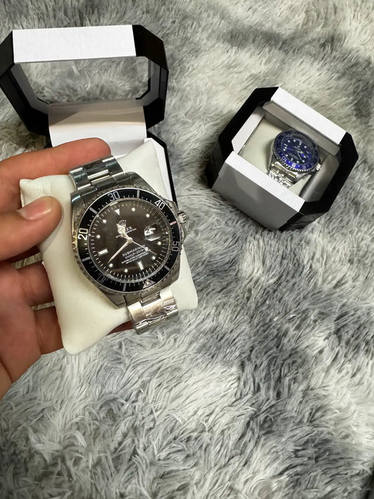 Reloj Rolex plateado negro detalles blancos