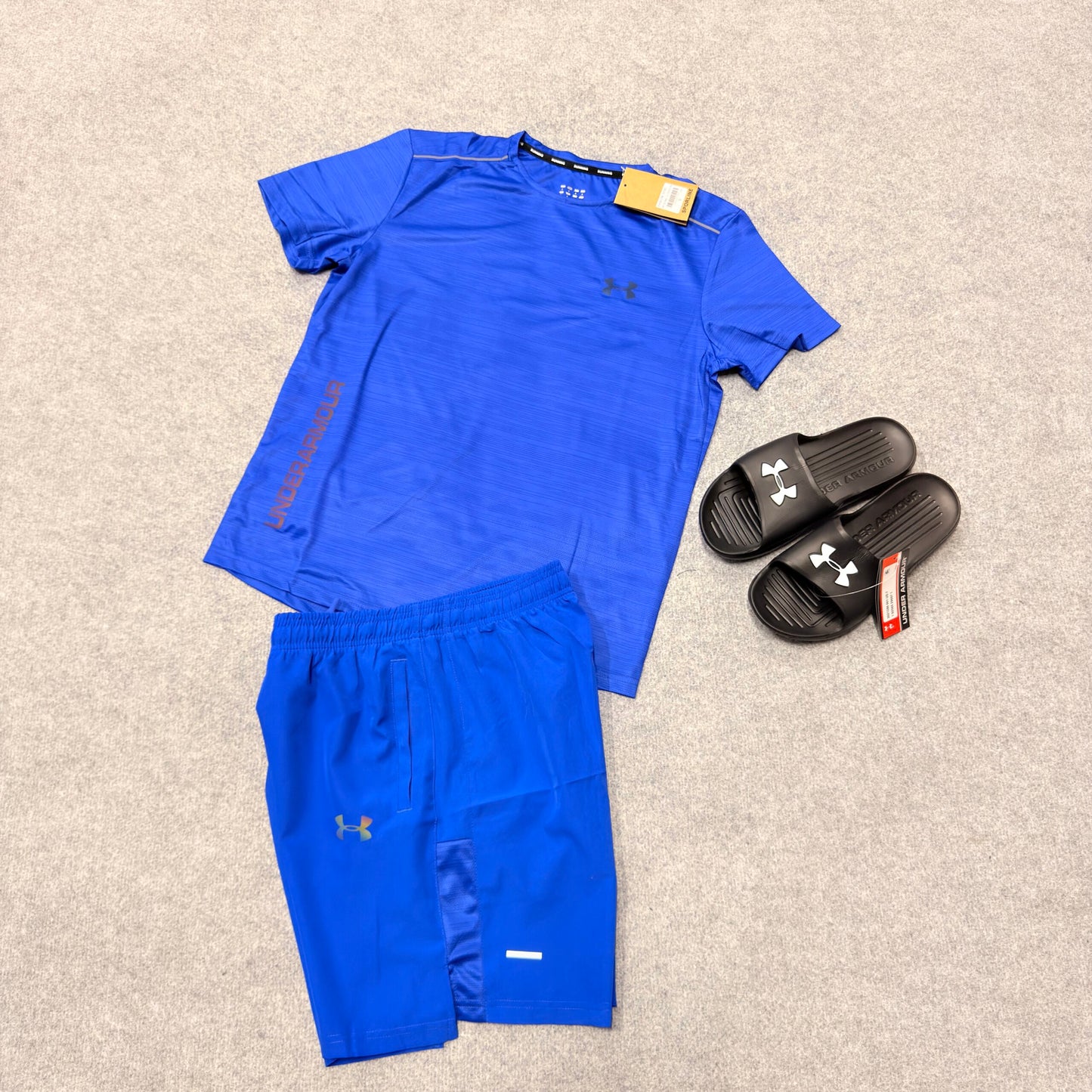 Conjunto under armour azul logo reflectante