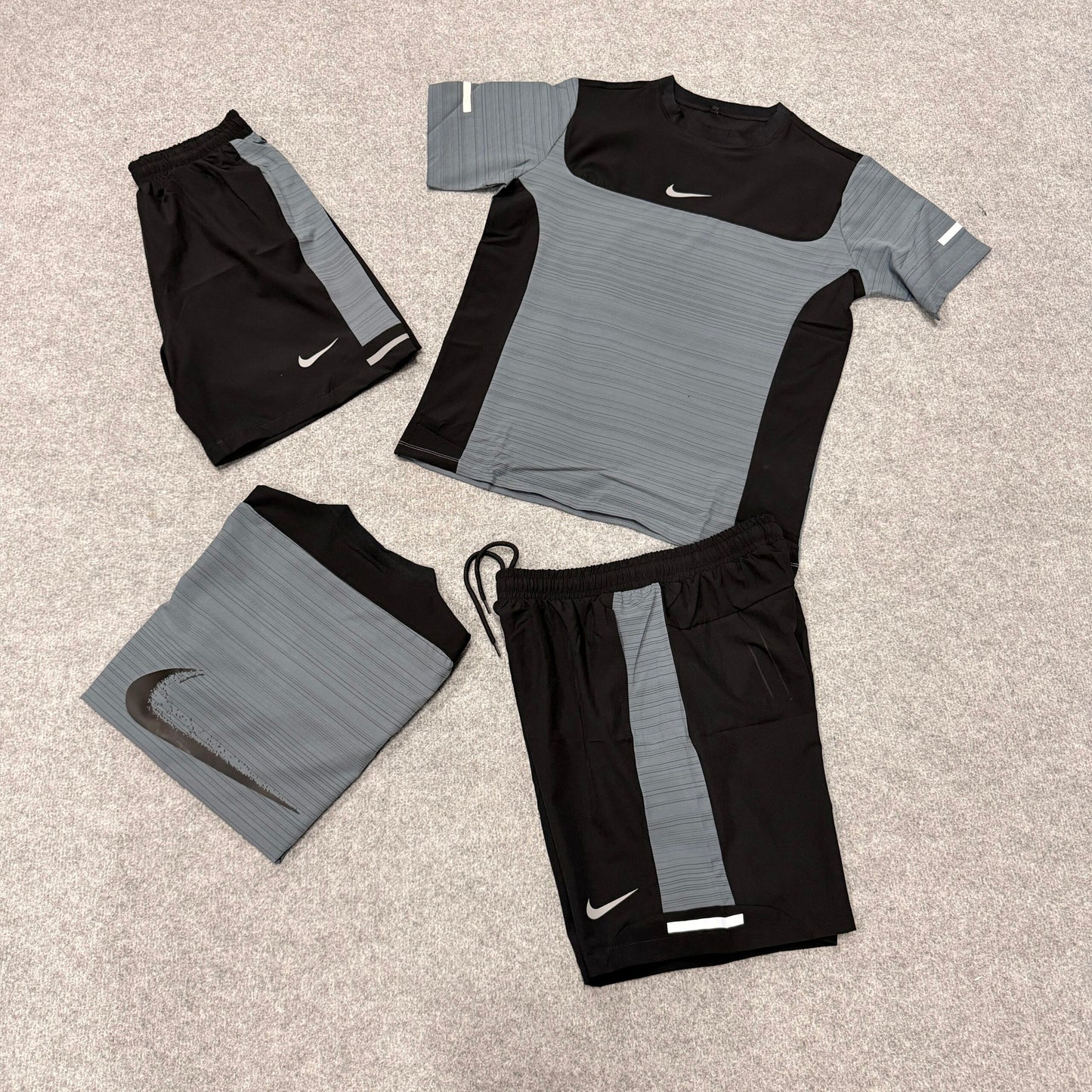 Conjunto nike negro y gris logo blanco